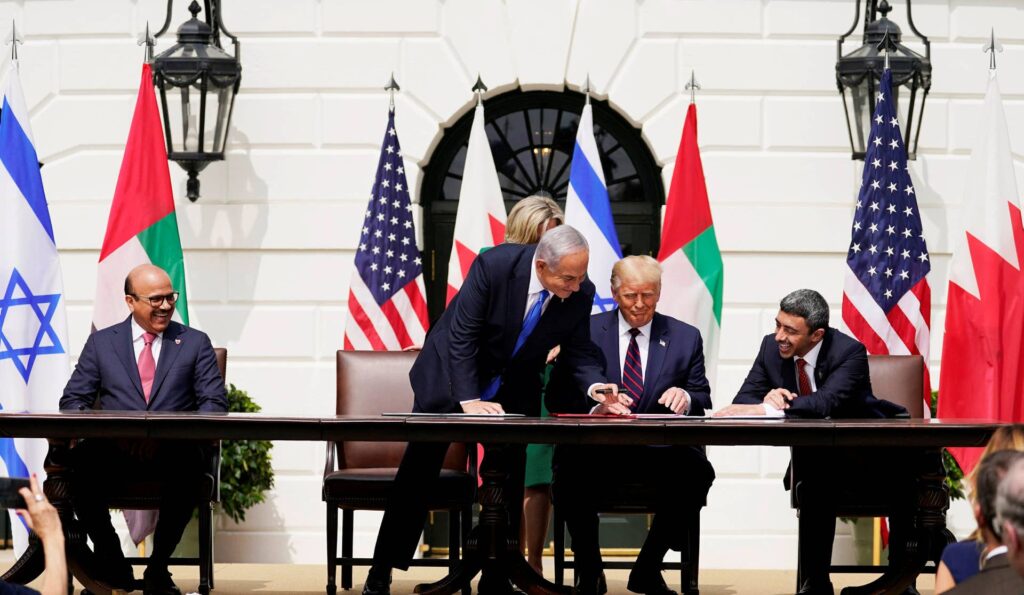 From left, Bahrain FM, Israeli PM, U.S. President, and UAE FM sign the Abraham Accords, Washington, DC, September 15, 2020.Credit: Alex Brandon/אי־פי